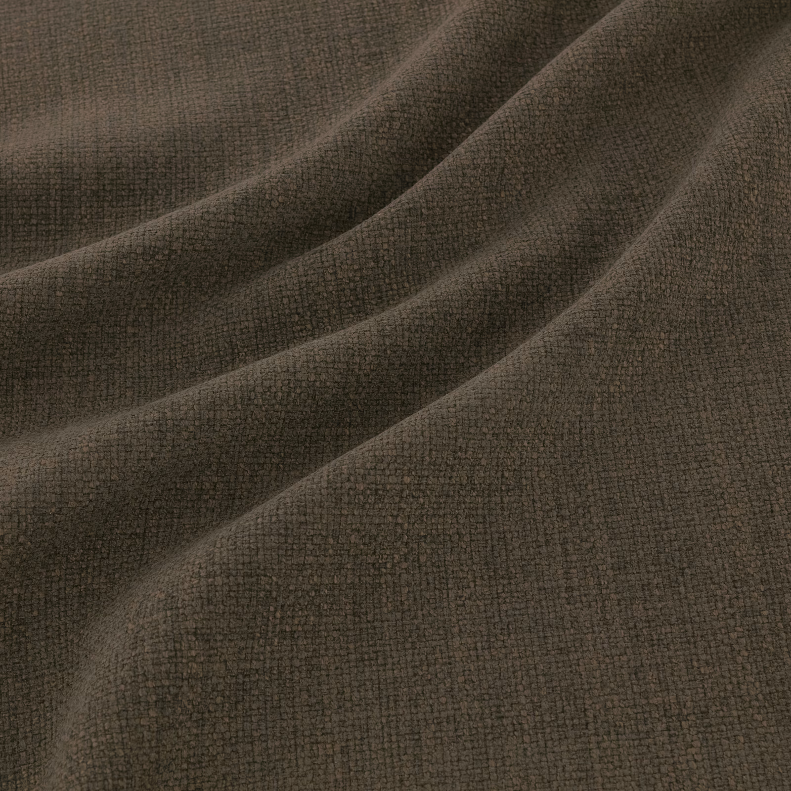 Dark pine-green woven textile with fine pebbled texture in soft folds