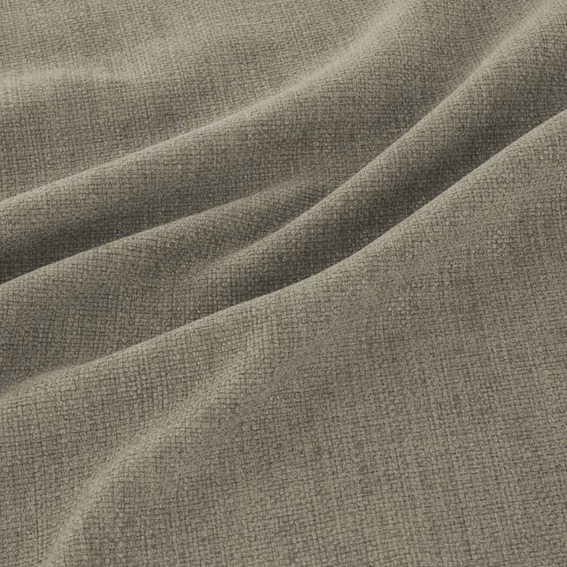 Muted grey sage woven fabric showing a fine pebbled texture in soft folds