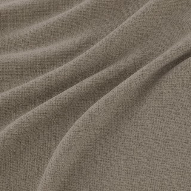 Smoky taupe-grey woven fabric with fine texture draped into soft diagonal folds