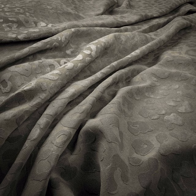 Iron-grey fabric with tonal organic spots and softly rippled, tactile folds