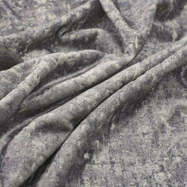 Cool aluminium-grey fabric with cloudy mottling, fine texture and softly folded drape