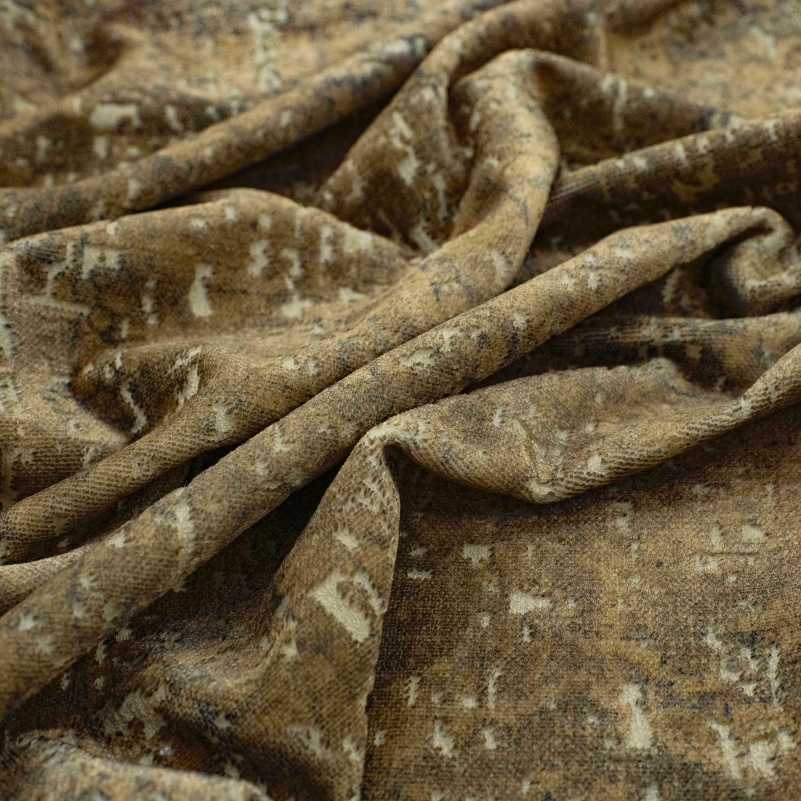 Mottled olive-brown Janssen Loden fabric with pale flecks and softly folded texture