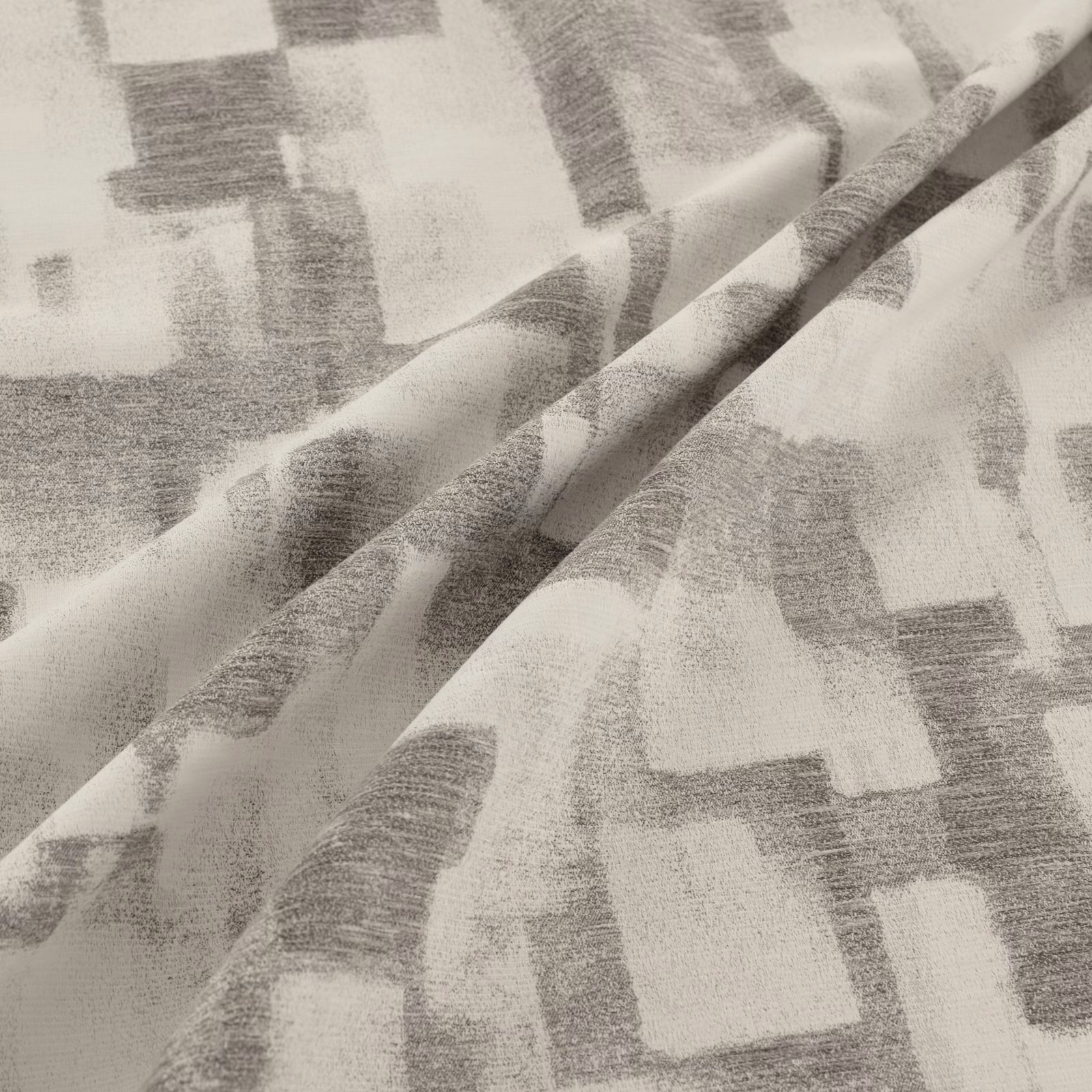 Soft magnesium-grey fabric with oversized blurred blocks and a lightly textured woven surface