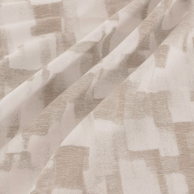 Pale taupe-grey woven fabric with abstract rectangular blocks and softly textured folds