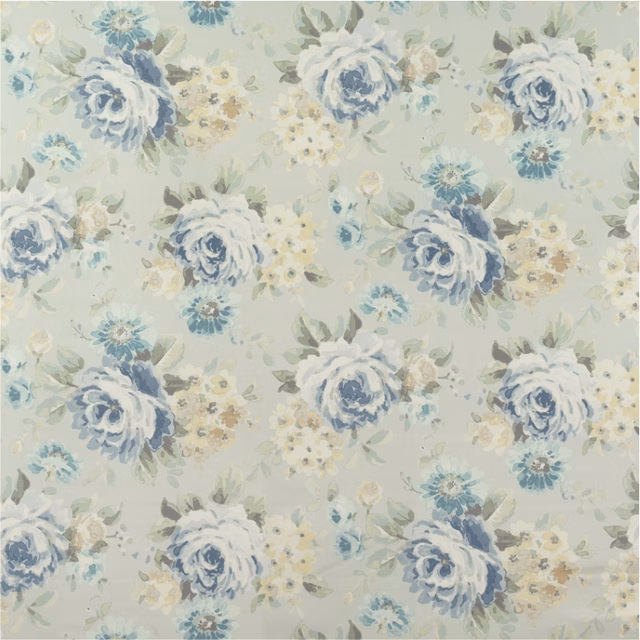 Pale celadon fabric with painterly blue roses, cream flowers and leafy sprays