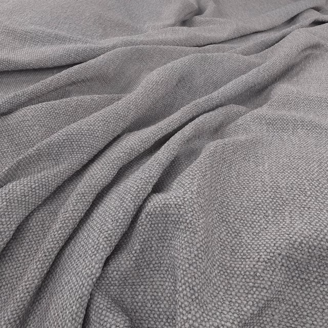 Soft mid-grey woven fabric with fine pebble texture arranged in loose folds