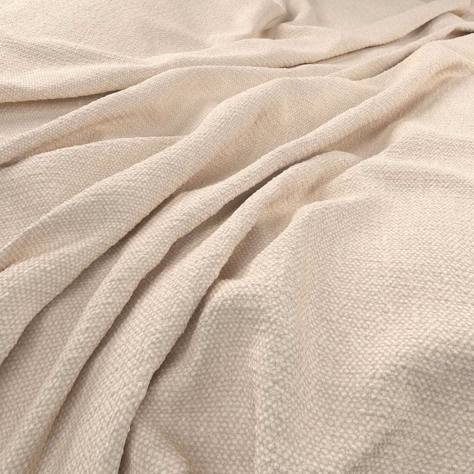Warm vanilla woven fabric with pebbled texture gathered into soft folds