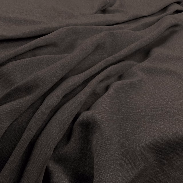 Deep anthracite fabric with fine woven texture gathered into soft, fluid folds