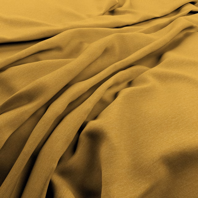 Draped warm marigold-yellow fabric showing fine weave and fluid gathered folds