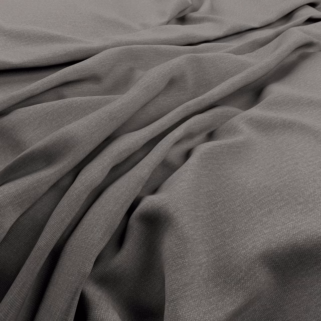 Fluid charcoal grey fabric showing a fine plain weave in softly gathered folds