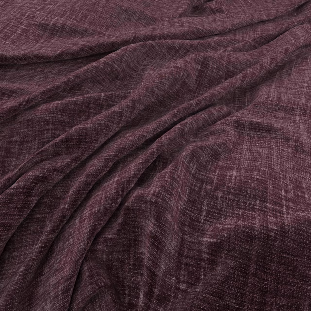 Deep amethyst fabric with fine crosshatch texture gathered into softly shadowed folds