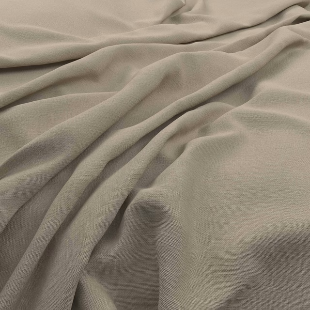 Muted warm greige plain weave fabric gathered into soft, fluid folds