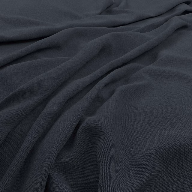 Deep blue-charcoal Koki fabric showing a fine plain weave in soft folds