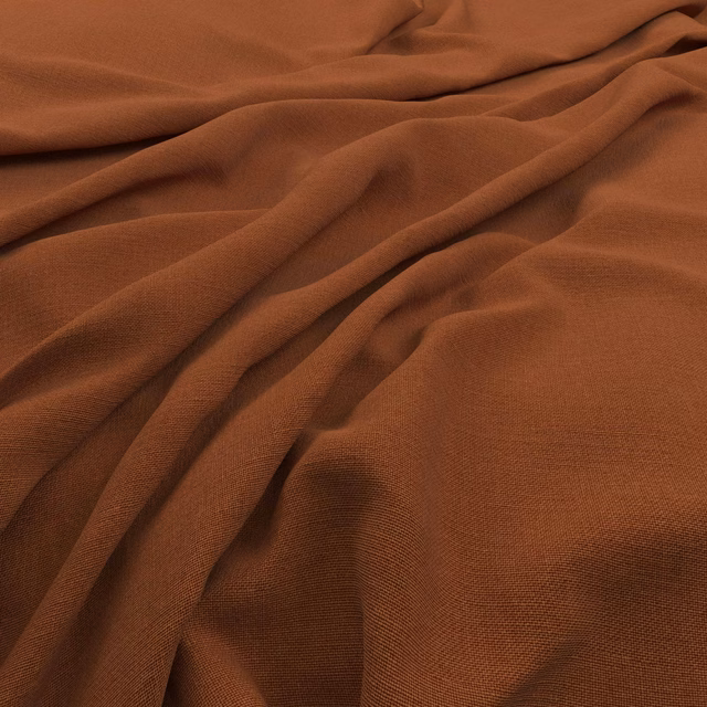 Burnt terracotta brown plain-weave fabric draped in soft folds with a fine textured surface