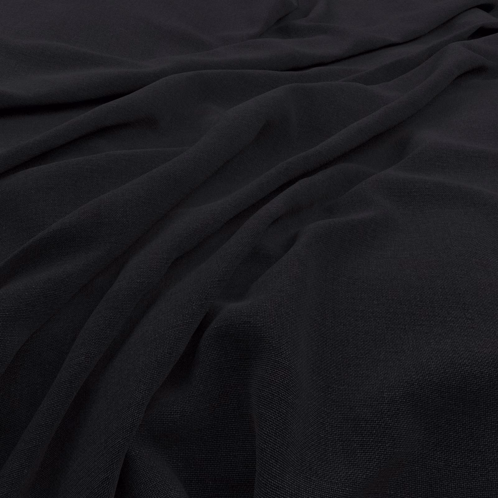 Near-black charcoal cloth in soft folds with a subtle fine woven texture
