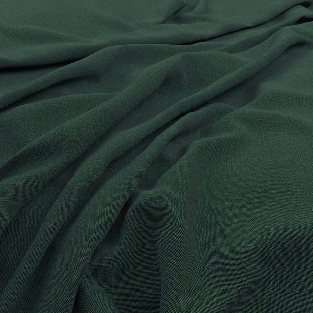 Deep clover-green Koki textile with fine weave and softly gathered folds