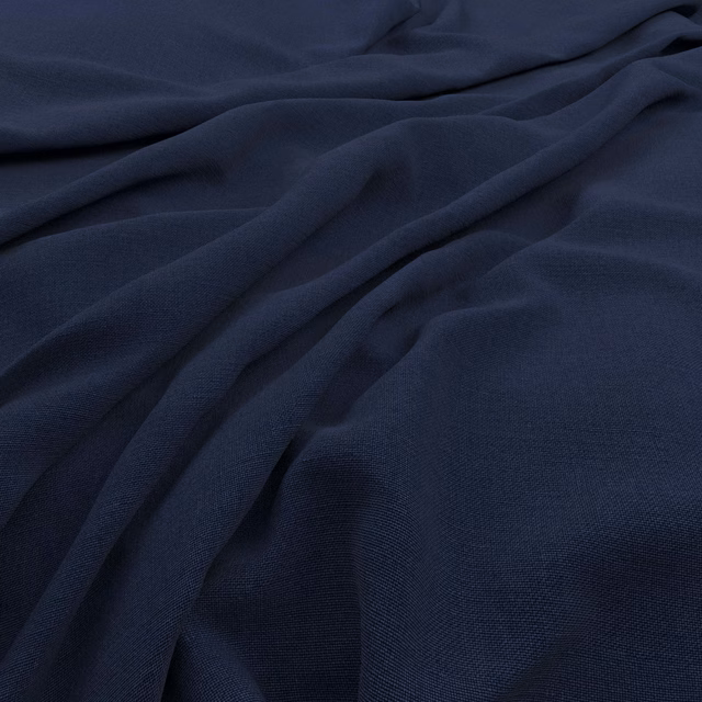 Deep ink-blue plain weave fabric gathered into soft, shadowed folds