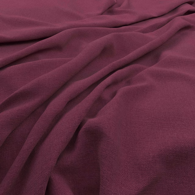 Deep plum Koki Lily fabric with fine woven texture and soft gathered folds