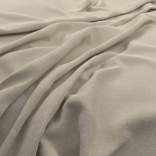Pale papyrus-beige plain weave fabric gathered into softly shadowed flowing folds