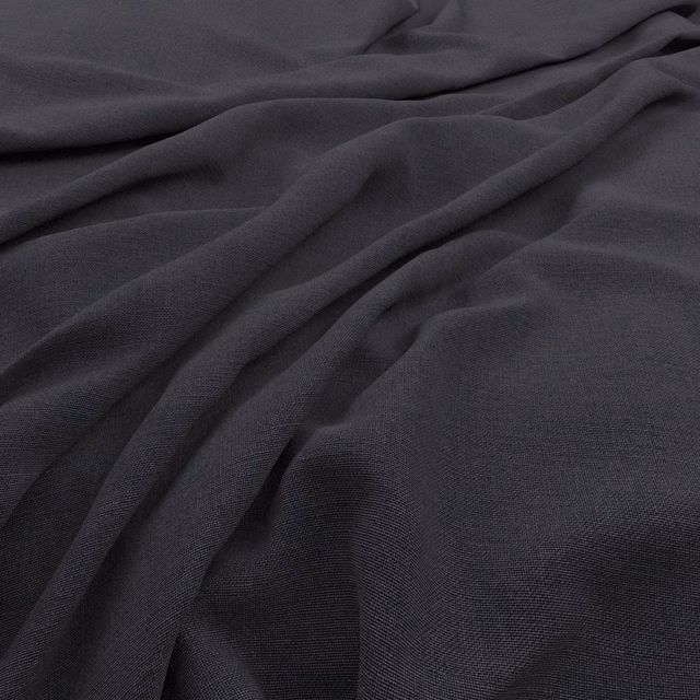 Dark pewter-grey fabric with a fine woven texture gathered into soft flowing folds.