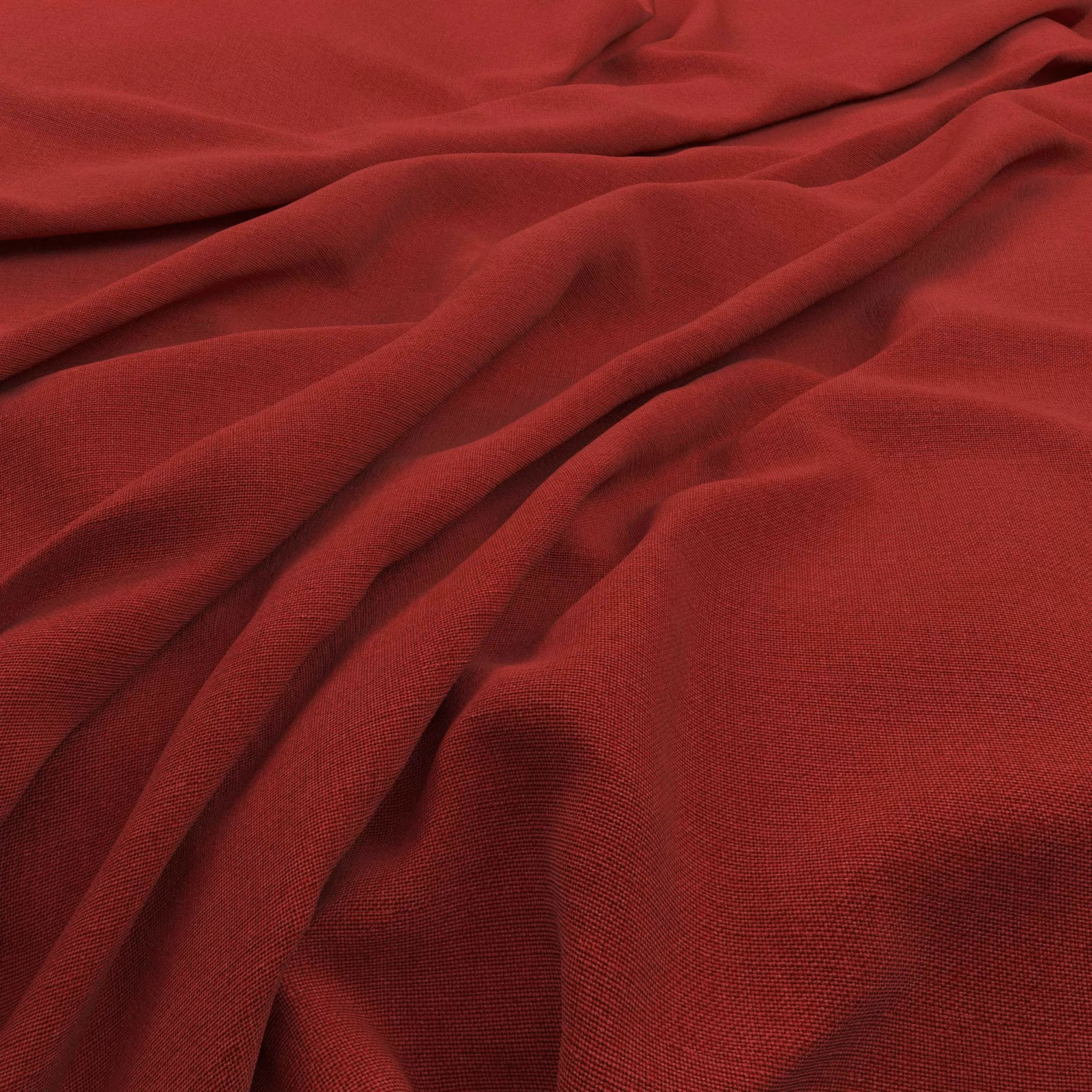 Saturated pillarbox-red fabric with fine weave, soft folds, and darker wine-toned shadows.