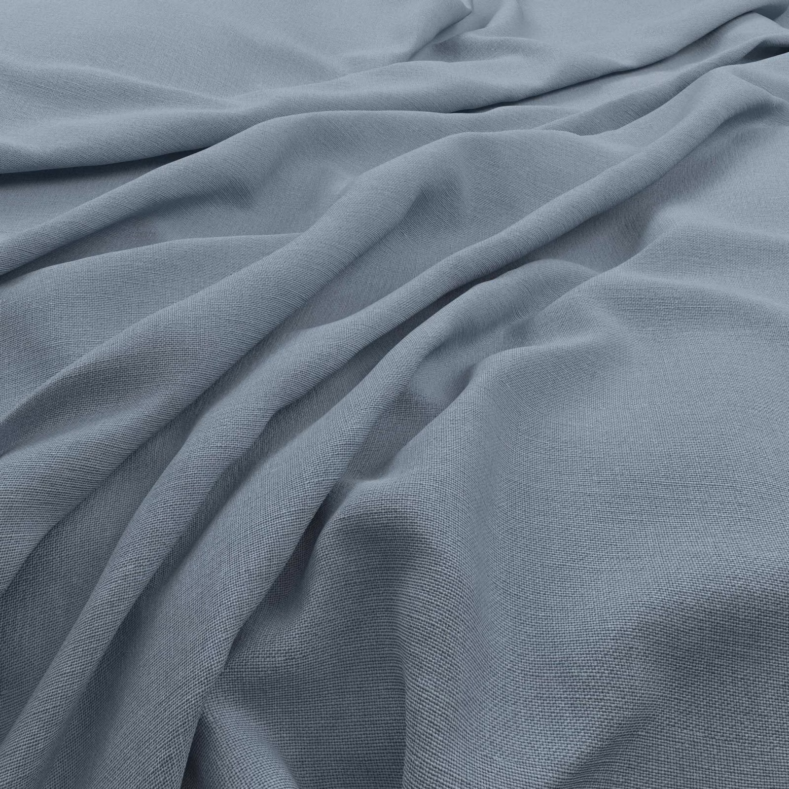 Powder blue-grey Koki fabric showing a fine plain weave in soft flowing folds