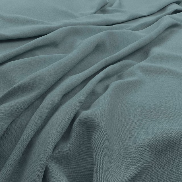 Cool muted teal fabric with a fine weave gathered into soft folds