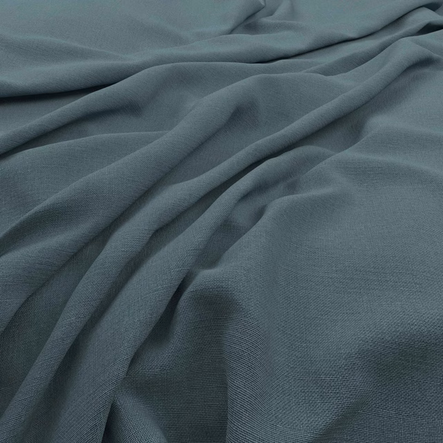 Muted blue-teal woven fabric shown in softly gathered folds with fine texture