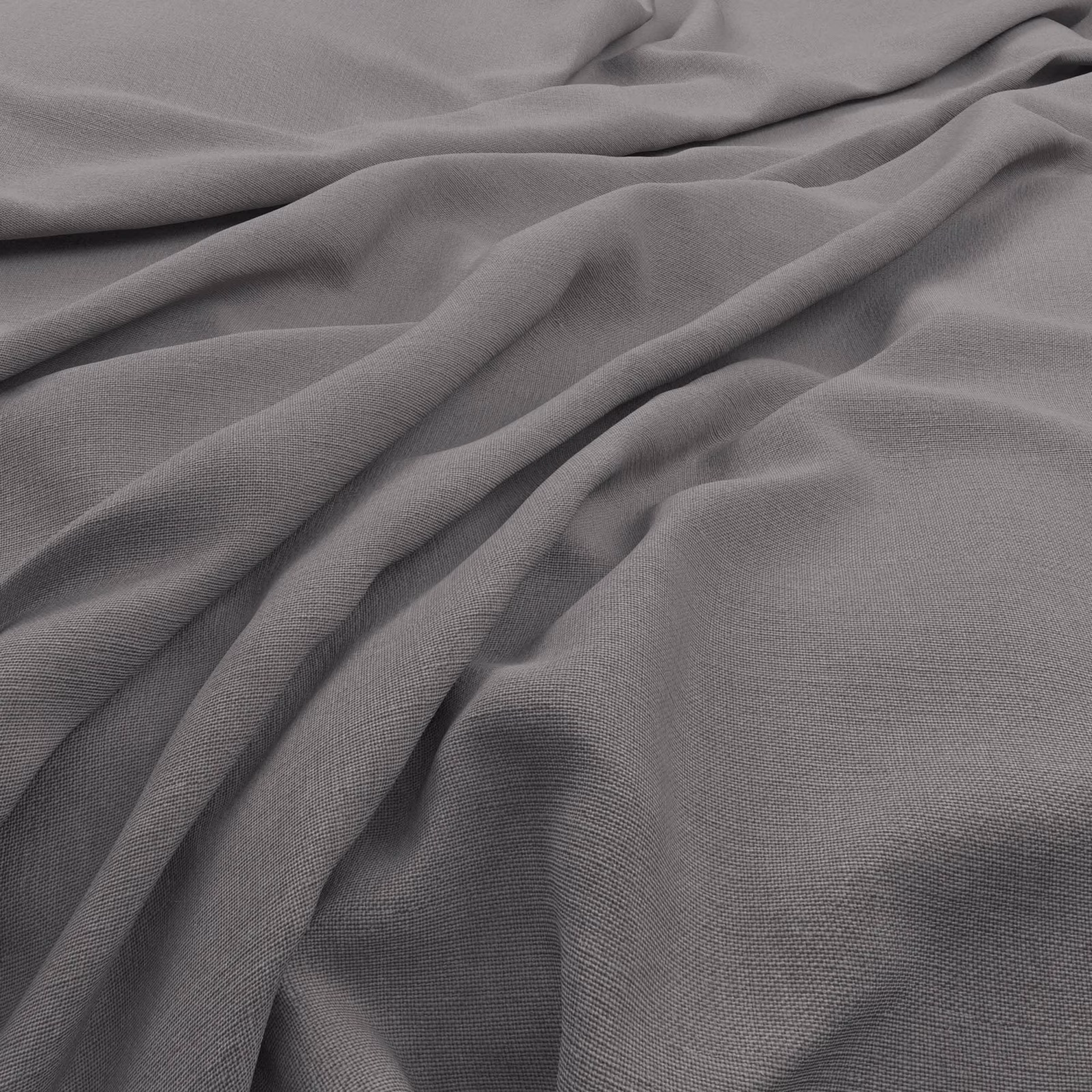 Close-up of cool smoke-grey fabric with fine weave and fluid draped folds