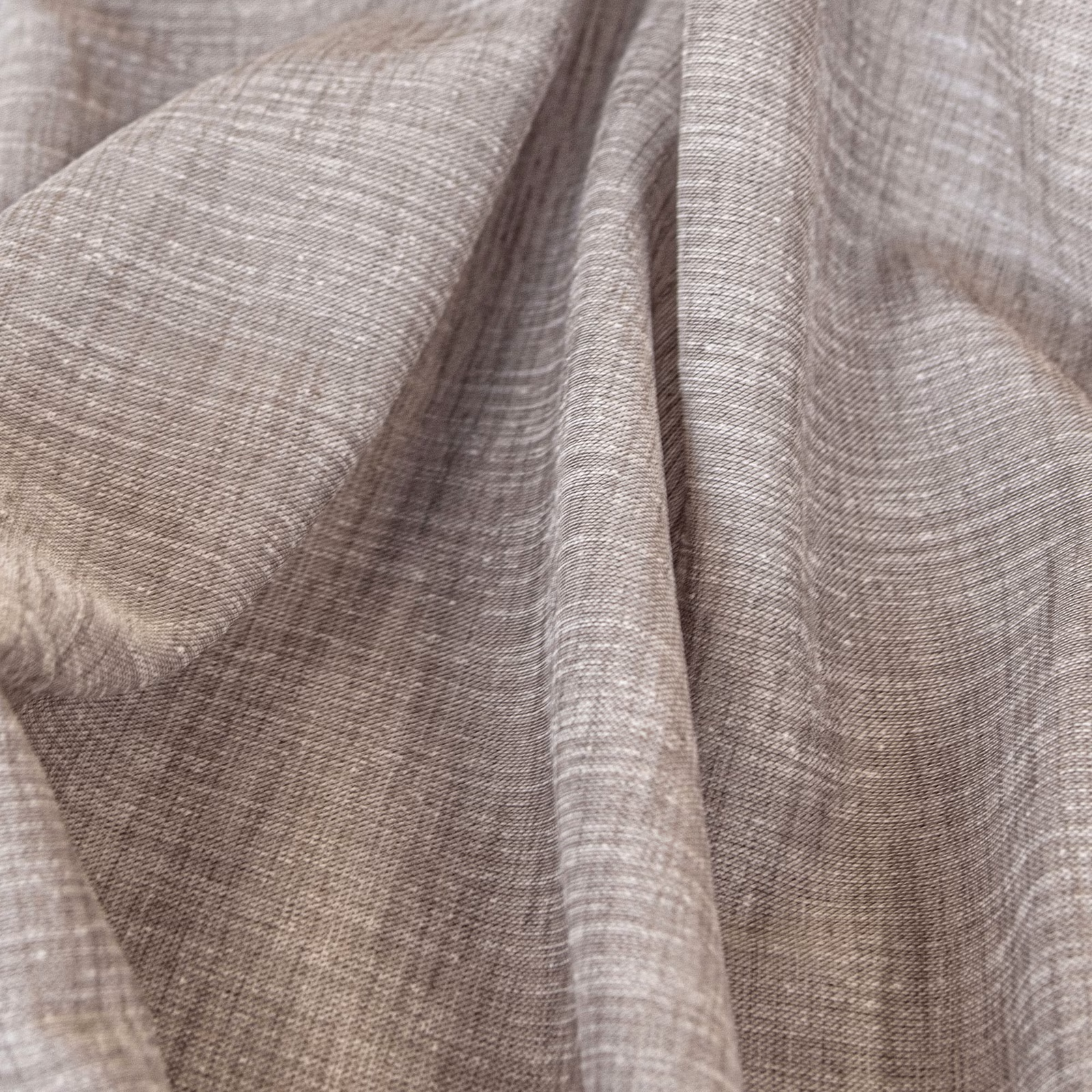 Soft taupe Kos fabric showing fine slubbed weave gathered into fluid folds