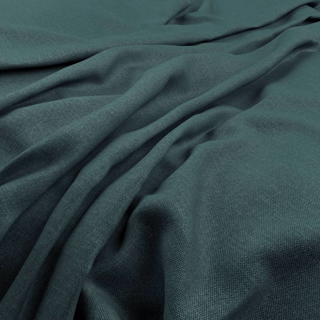 Deep Amazon teal fabric with fine woven texture falling in soft, fluid folds