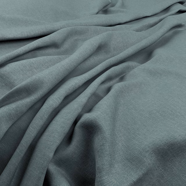 Muted azure blue-grey fabric with a fine woven texture arranged in soft flowing folds