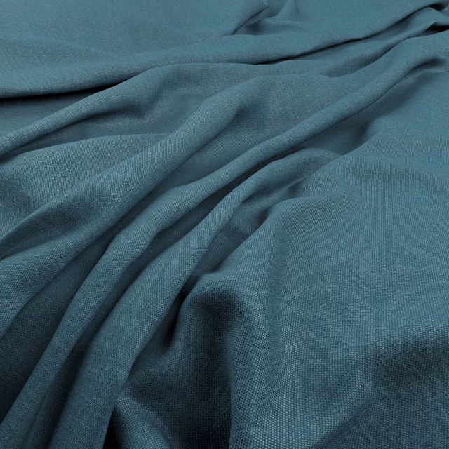 Deep kingfisher teal fabric with fine weave and softly gathered fluid folds