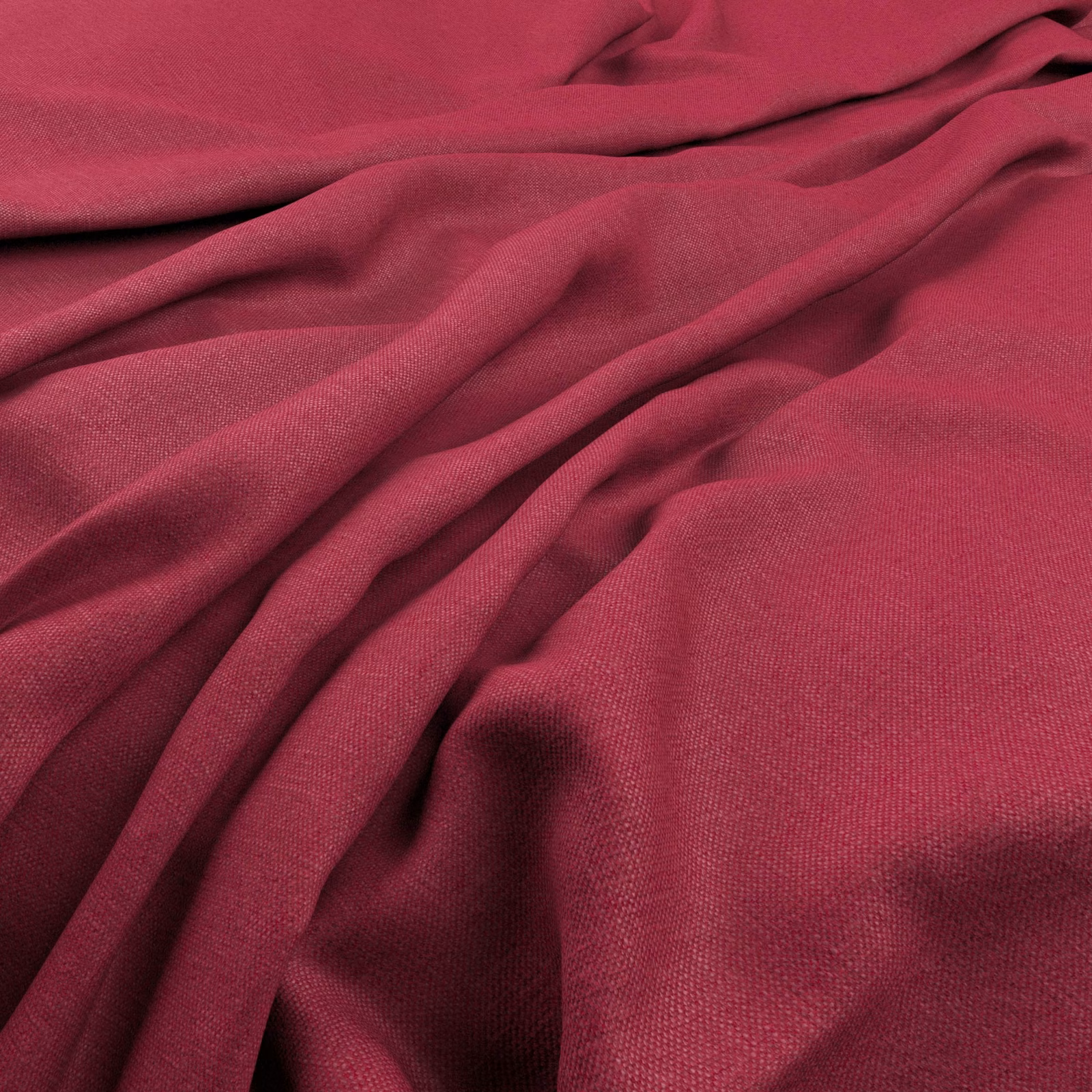 Deep raspberry-pink plain weave fabric gathered into softly shadowed folds
