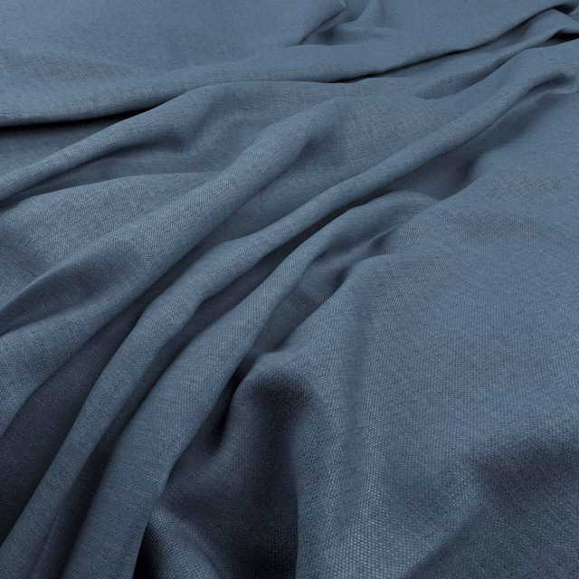 Slate marine-blue woven cloth gathered into soft, shadowed folds