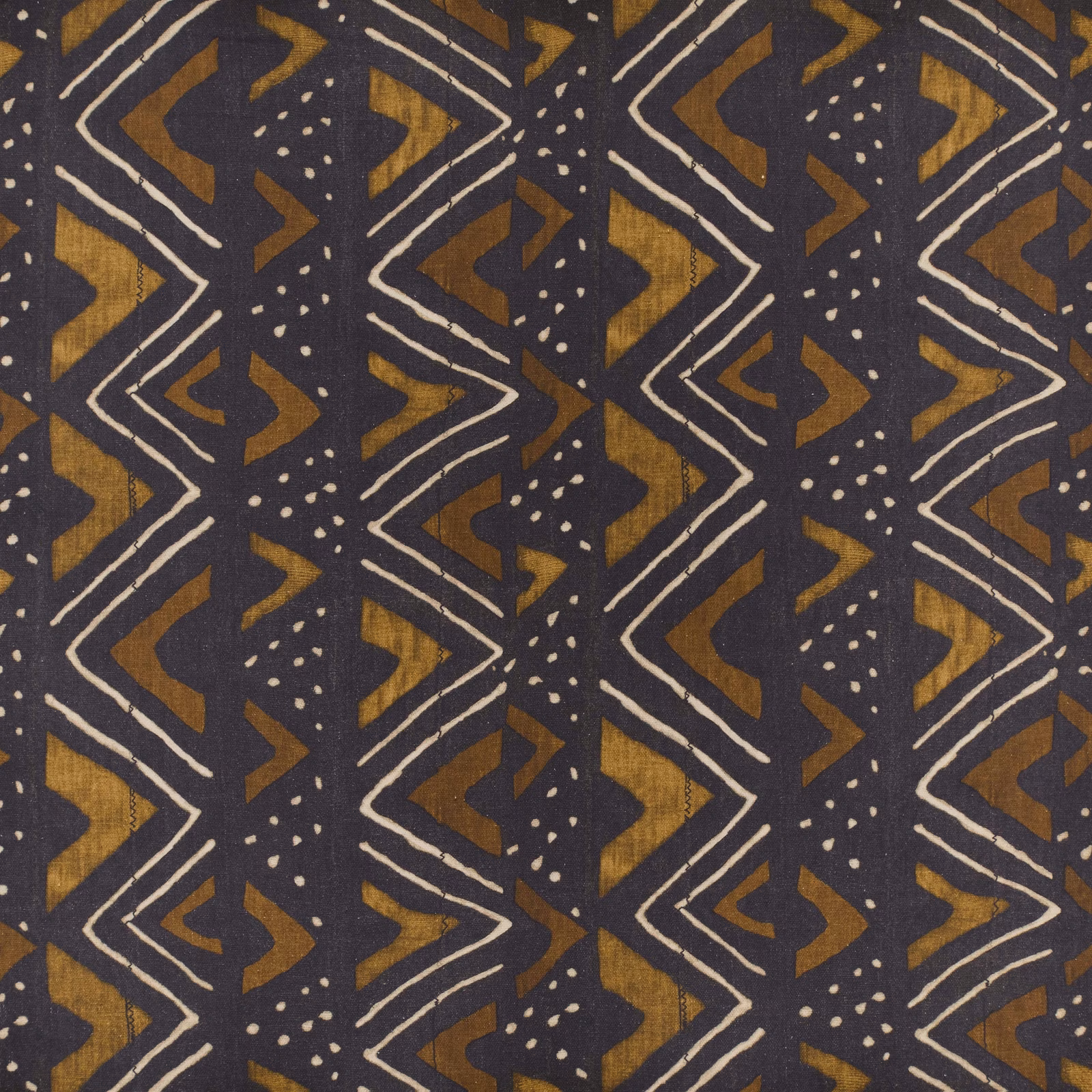 Charcoal Kuba textile with ochre geometric shapes, ivory lines and dotted motifs