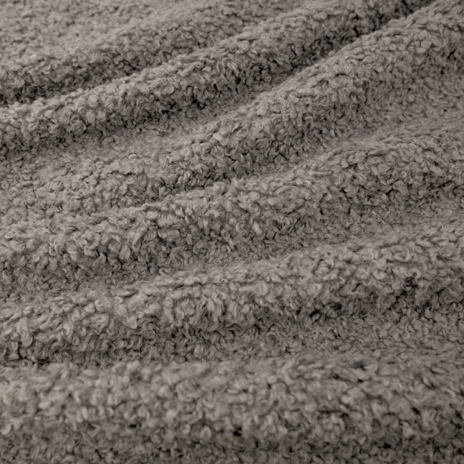Soft mid-grey Lambert fabric with dense curly pile and rippled tactile texture