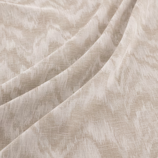 Pale greige fabric with distressed striations and softly folded woven texture