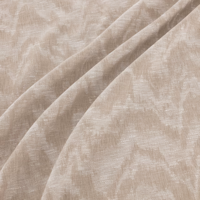 Warm beige fabric with irregular brushed striations and a lightly slubbed woven texture