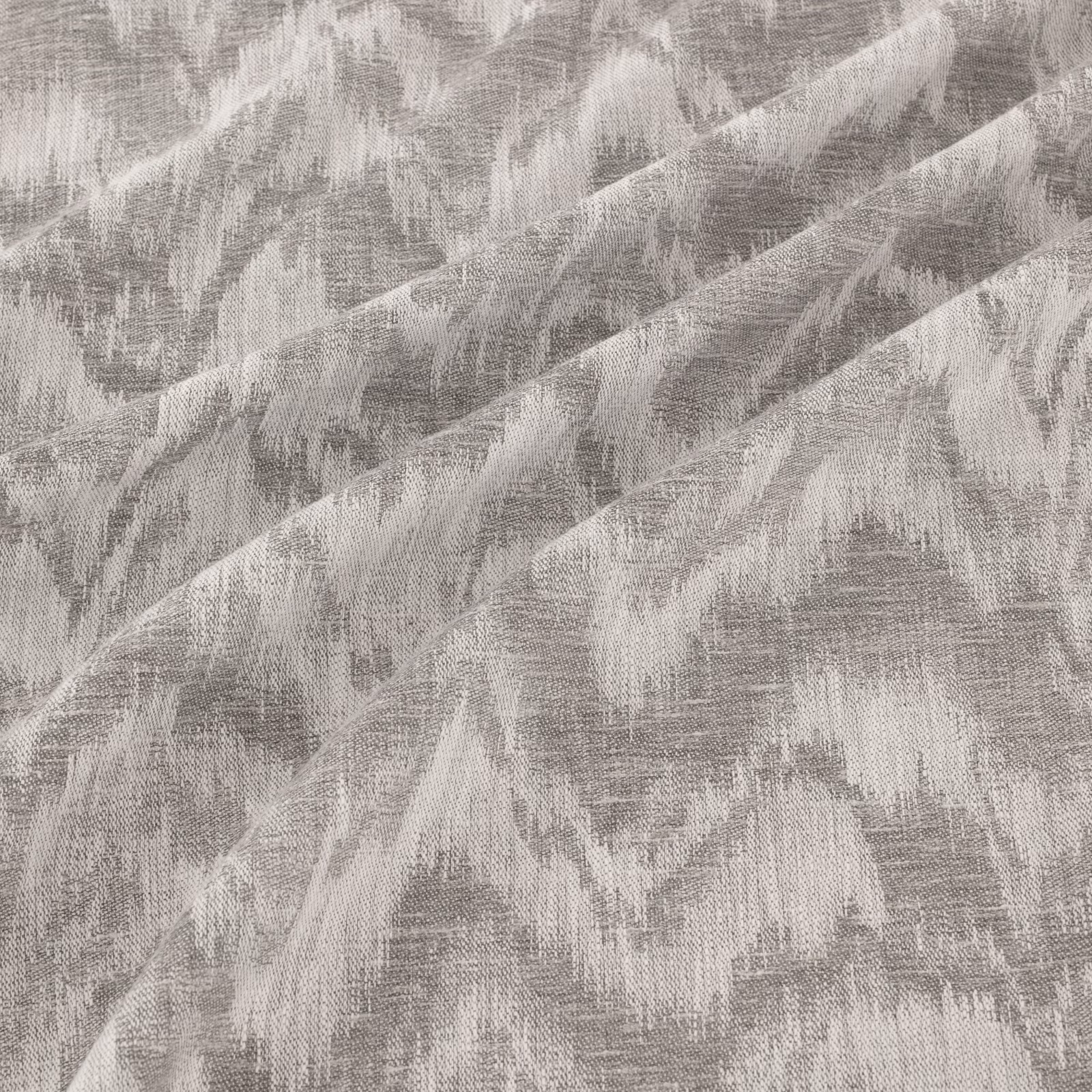 Cool steel-grey woven surface with pale, sweeping painterly brush marks
