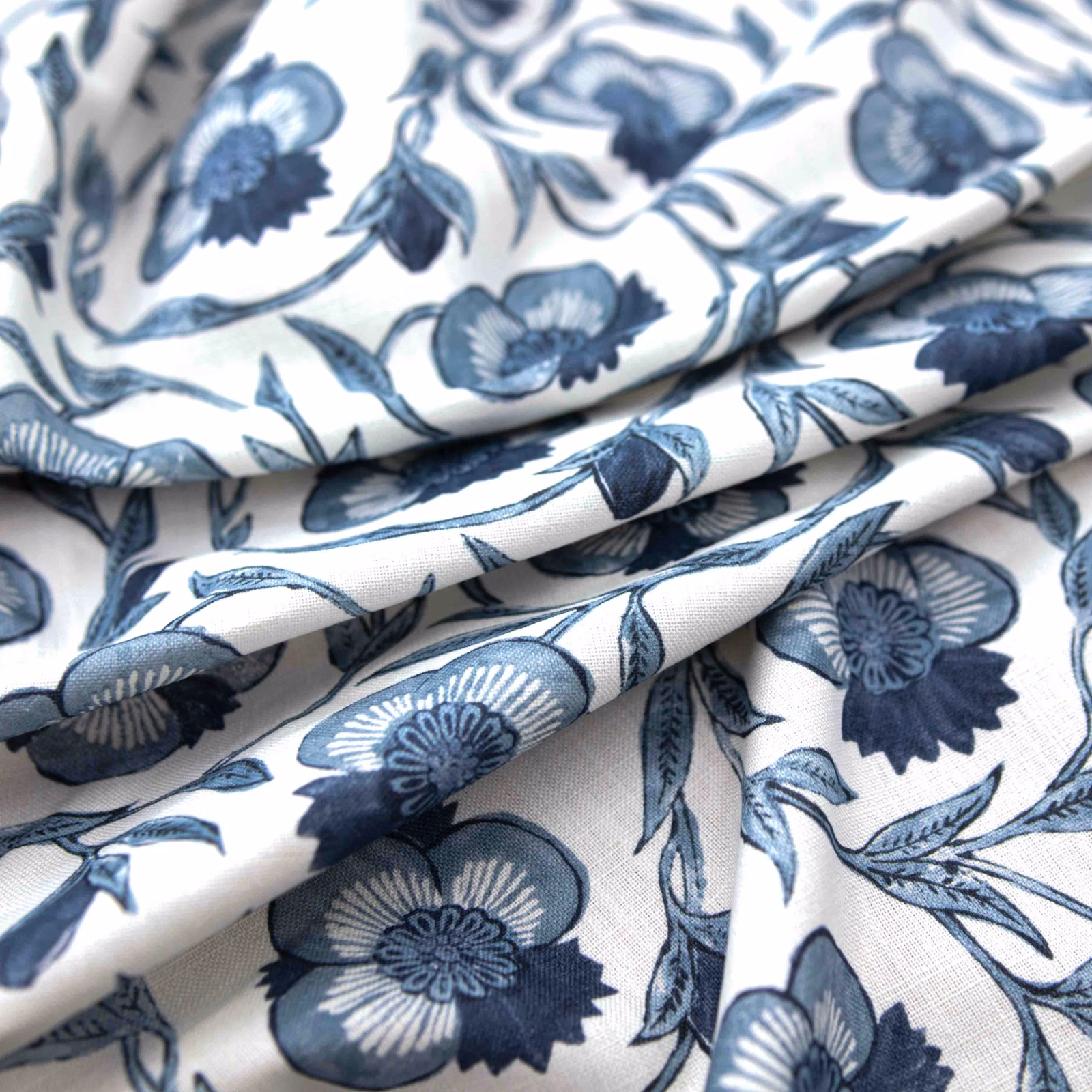 Cream Laurel fabric with navy and blue flower sprays and fine woven texture