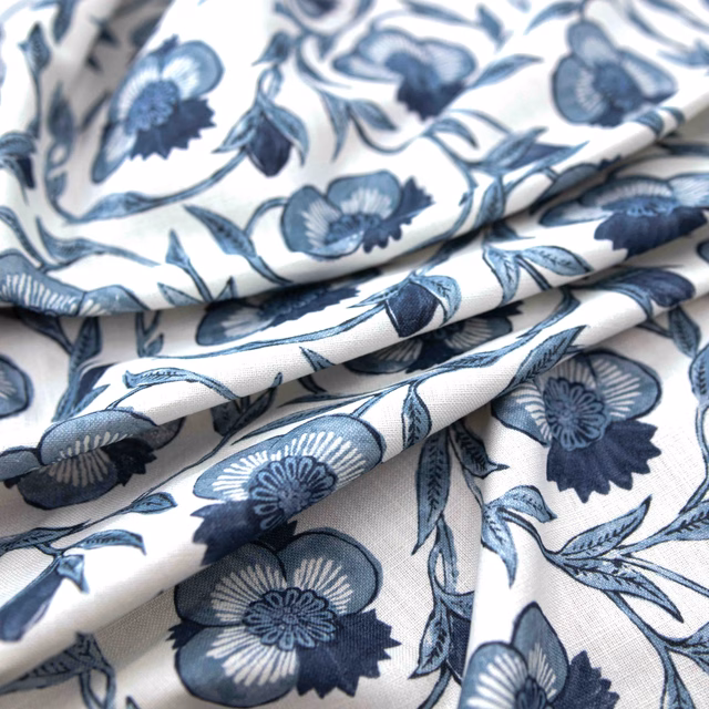 Cream Laurel fabric with navy and blue flower sprays and fine woven texture