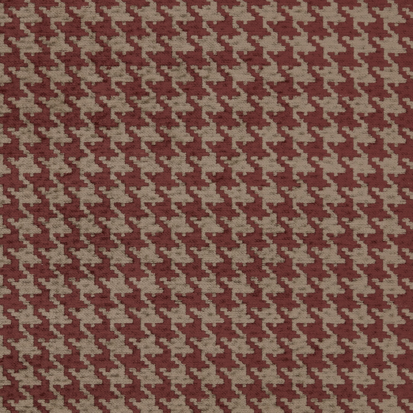 Close-up of muted red and beige houndstooth woven upholstery fabric