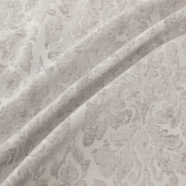 Pale silver-grey damask with tonal floral motifs and a softly reflective folded weave