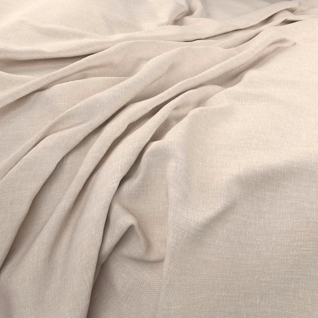 Warm alabaster plain weave draped in soft folds, showing a fine surface texture