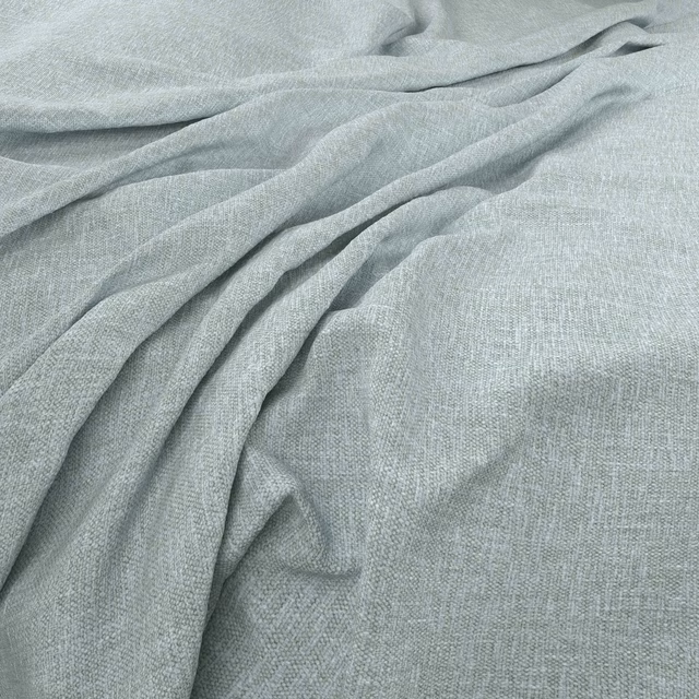 Pale blue-grey Linden Azure fabric with a fine woven texture in soft folds