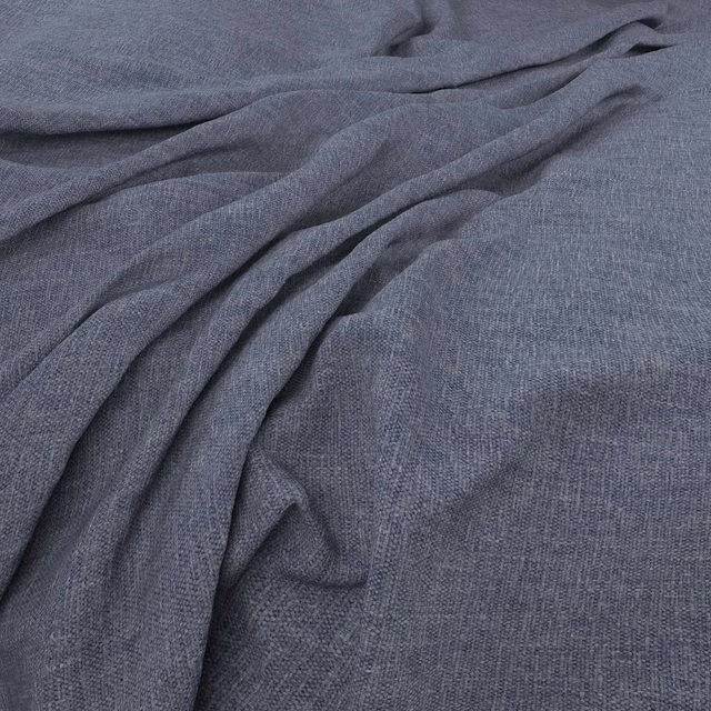 Dusky blue-grey woven fabric gathered into soft, fluid folds