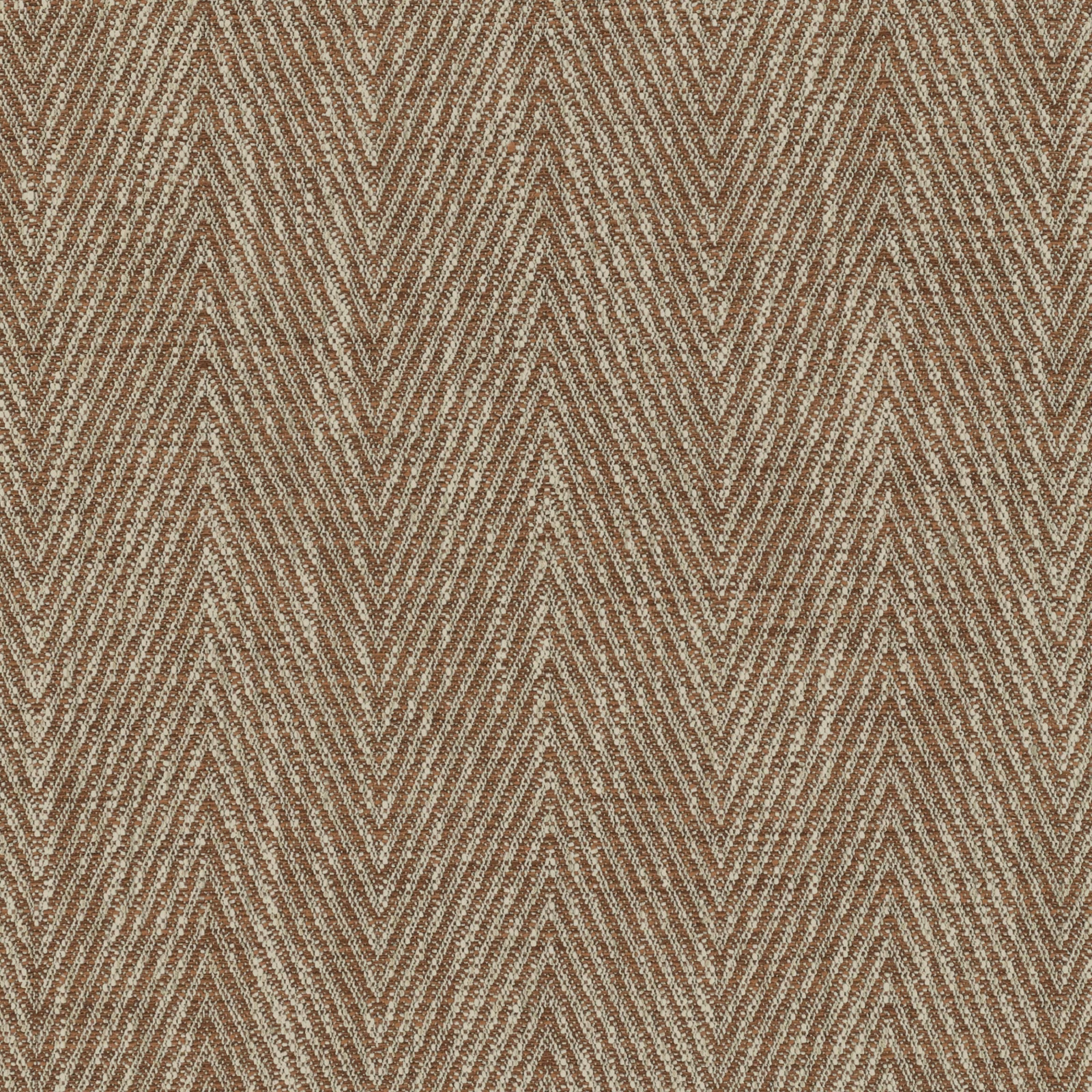 Close-up of warm rust-brown woven textile with repeating cream chevron stripes