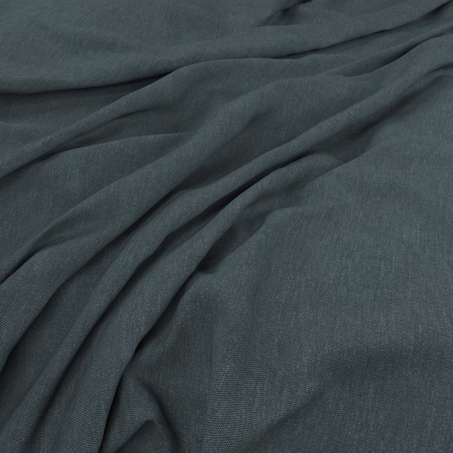 Deep blue-teal finely woven fabric draped in soft folds with subtle surface texture