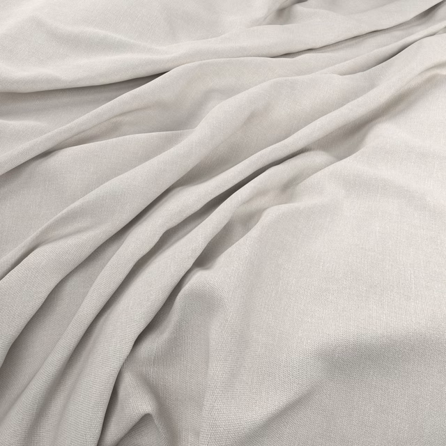 Pale limewashed greige fabric in soft folds, showing a fine even woven texture